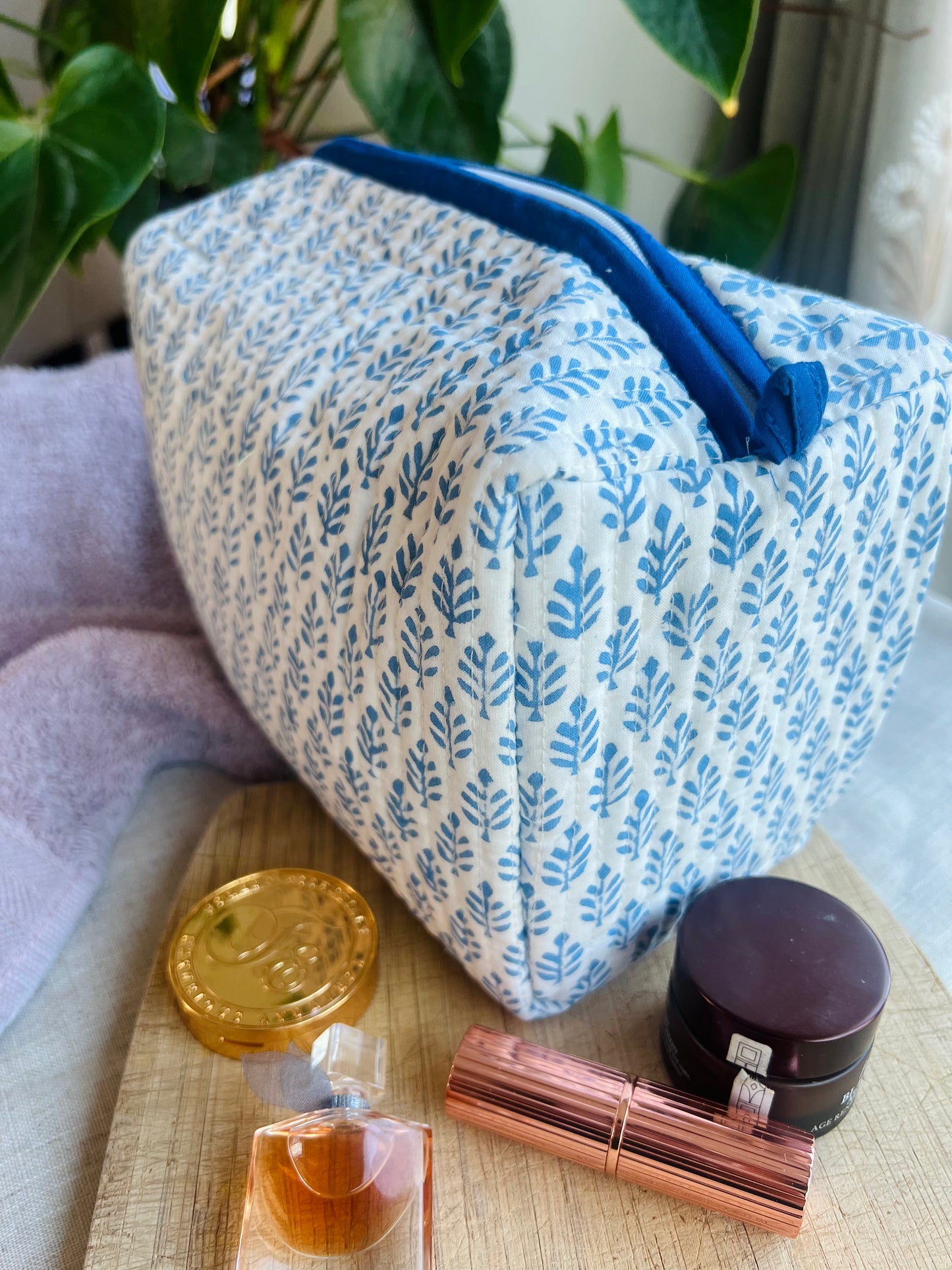 Handcrafted quilted toiletry bag with block print design.