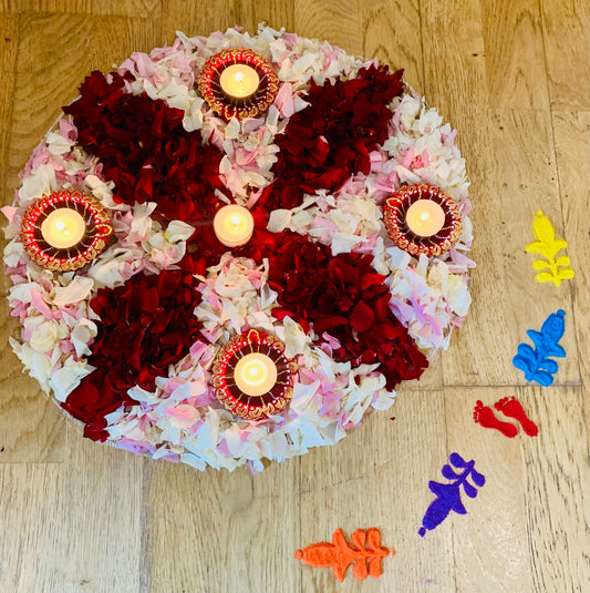 Diwali rangoli with flowers and diyas