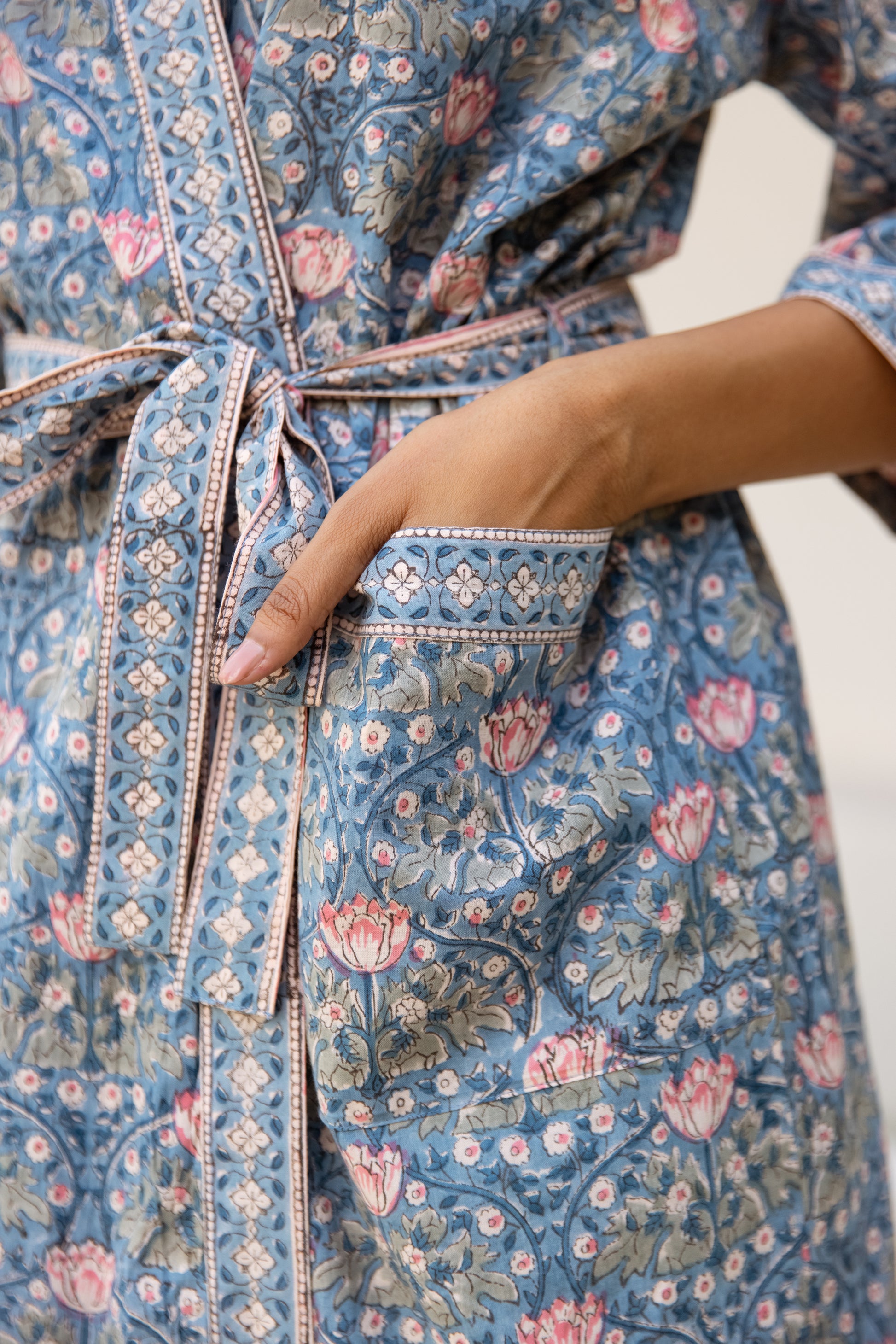 Close-up of hand block printed cotton robe with tie belt detail