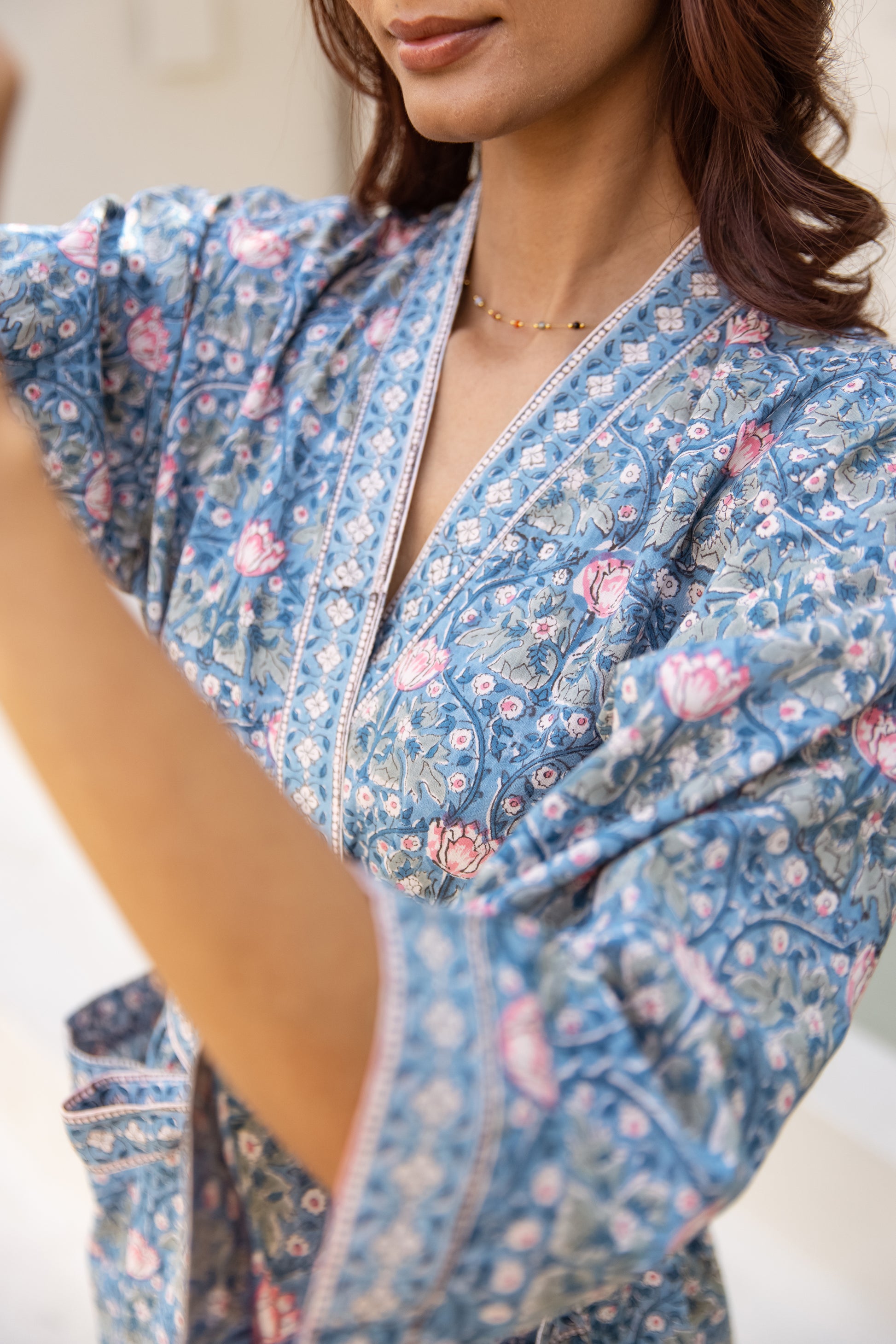 Close-up of neckline and printed border trim detail