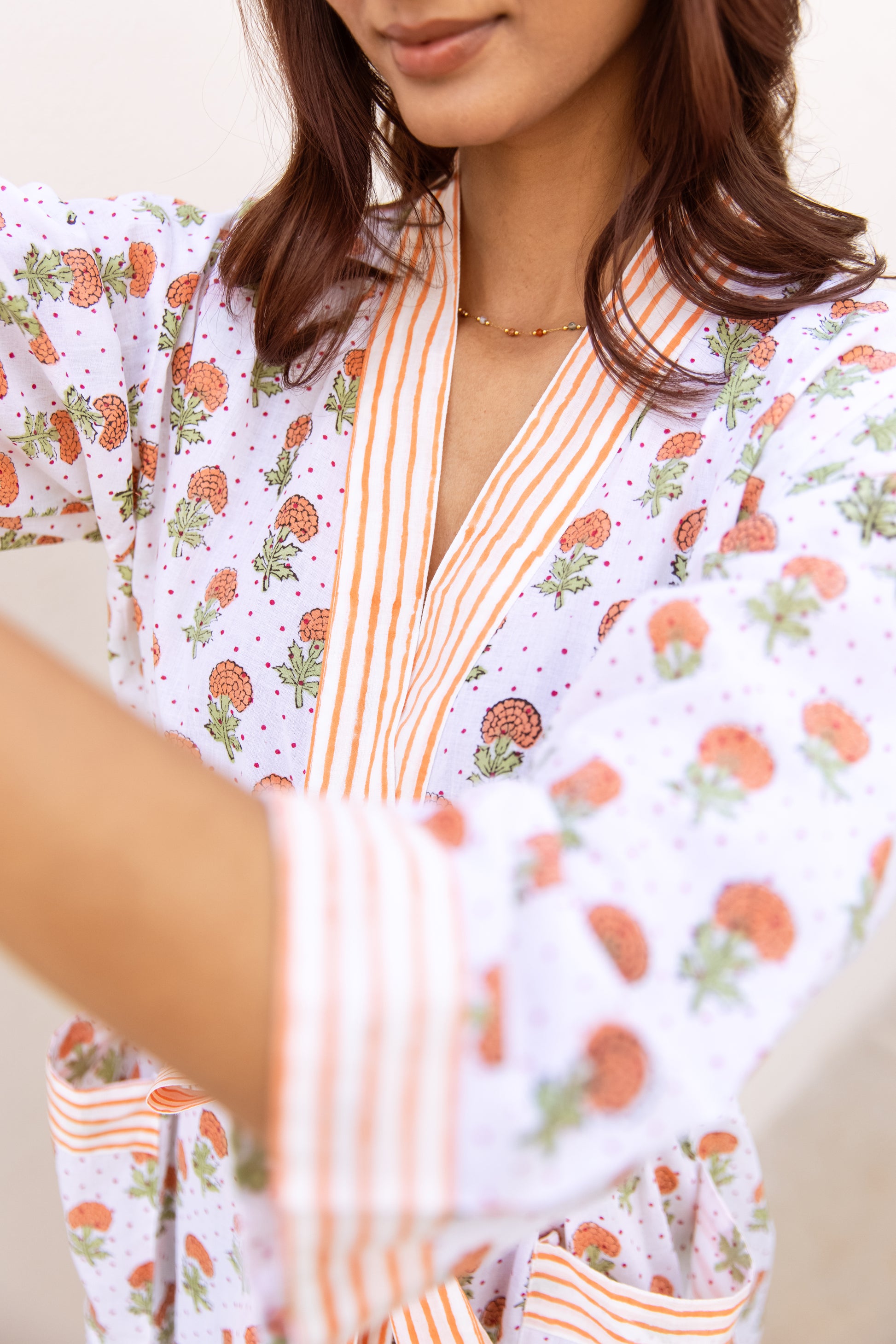 Close-up of striped trim and sleeve detail