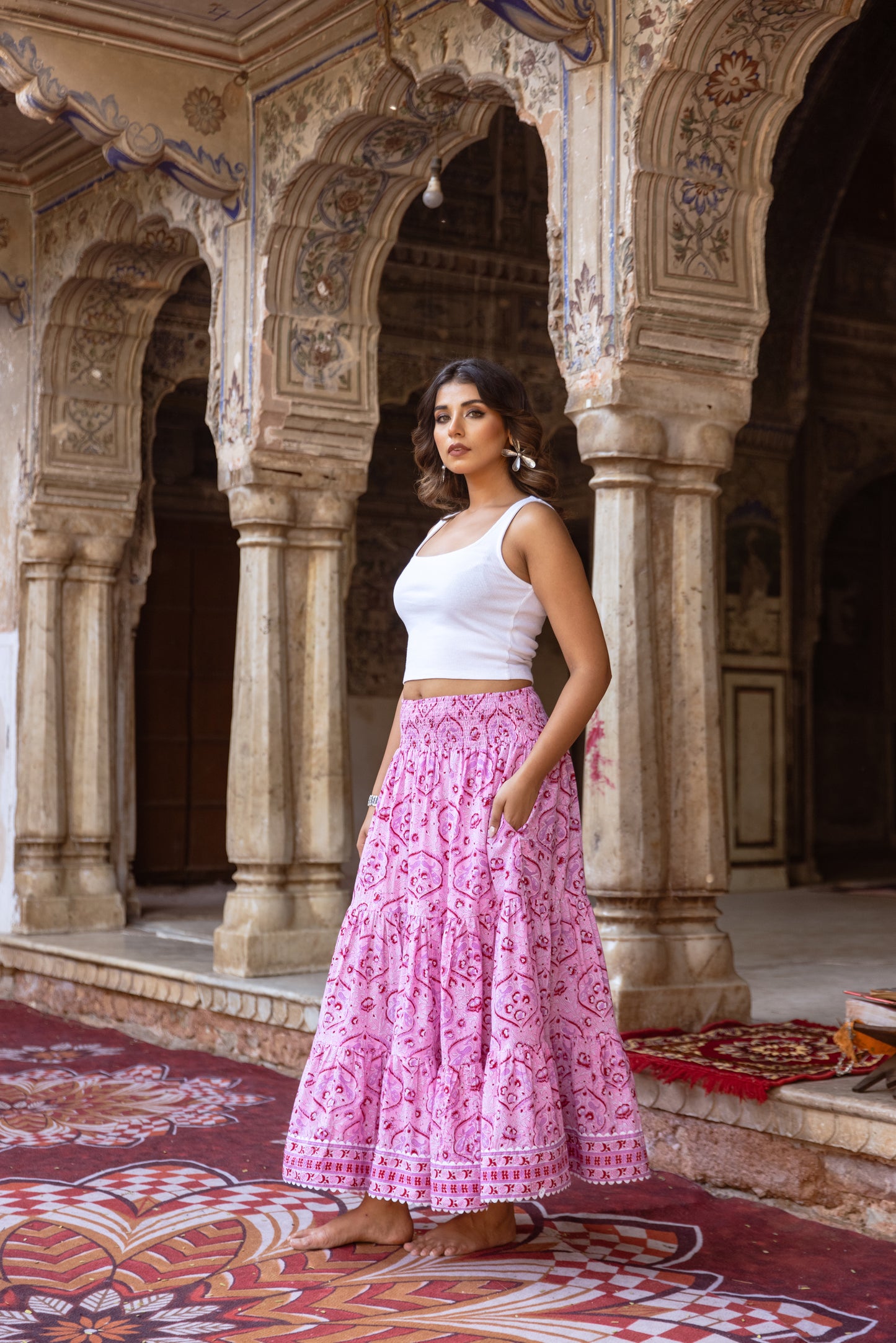 Back view of pink cotton maxi skirt with smocked waistband