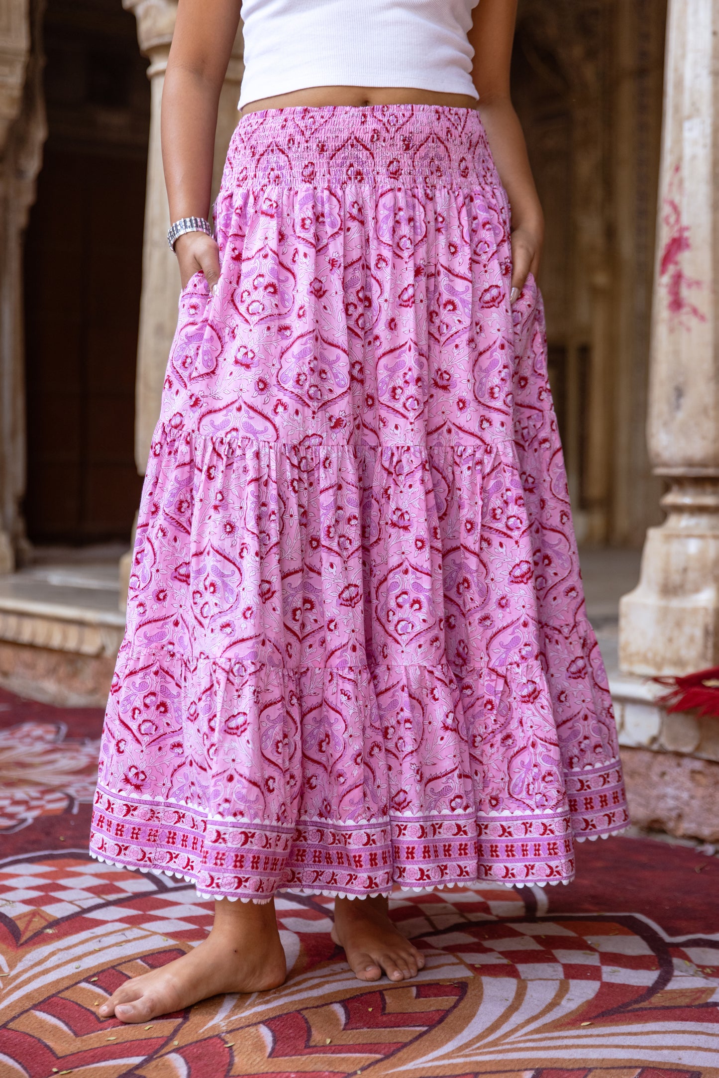 Front view of tiered pink floral cotton maxi skirt