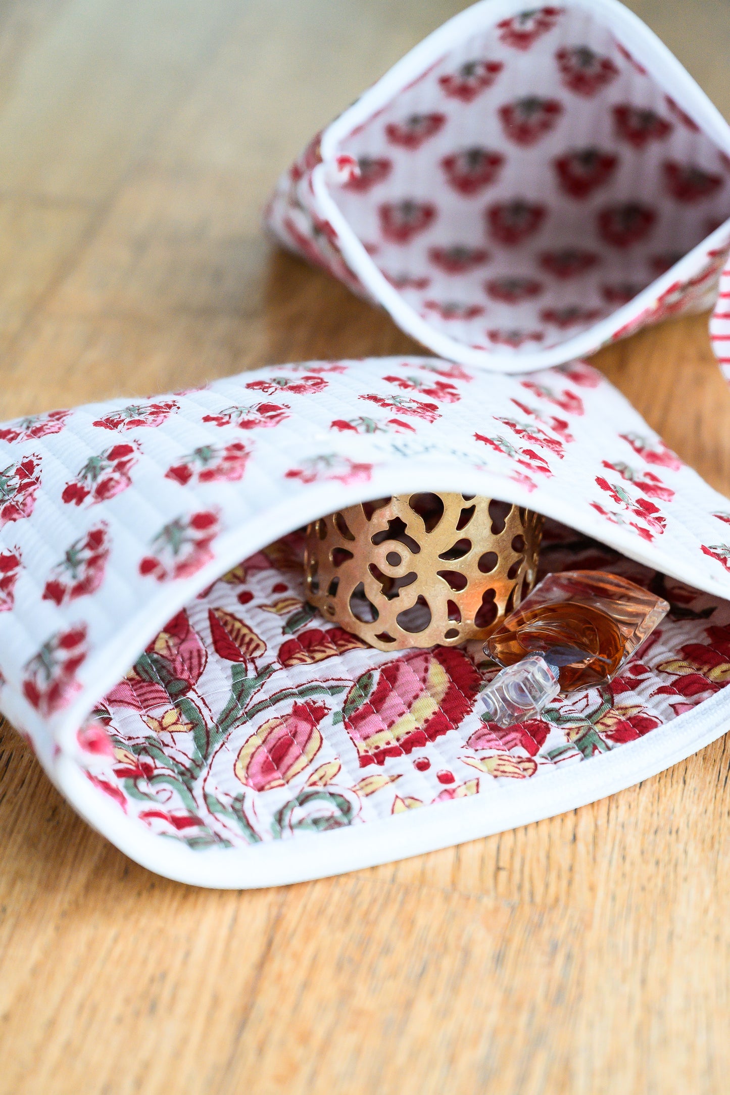 Crimson Bloom floral quilted pouches with zip closure.
