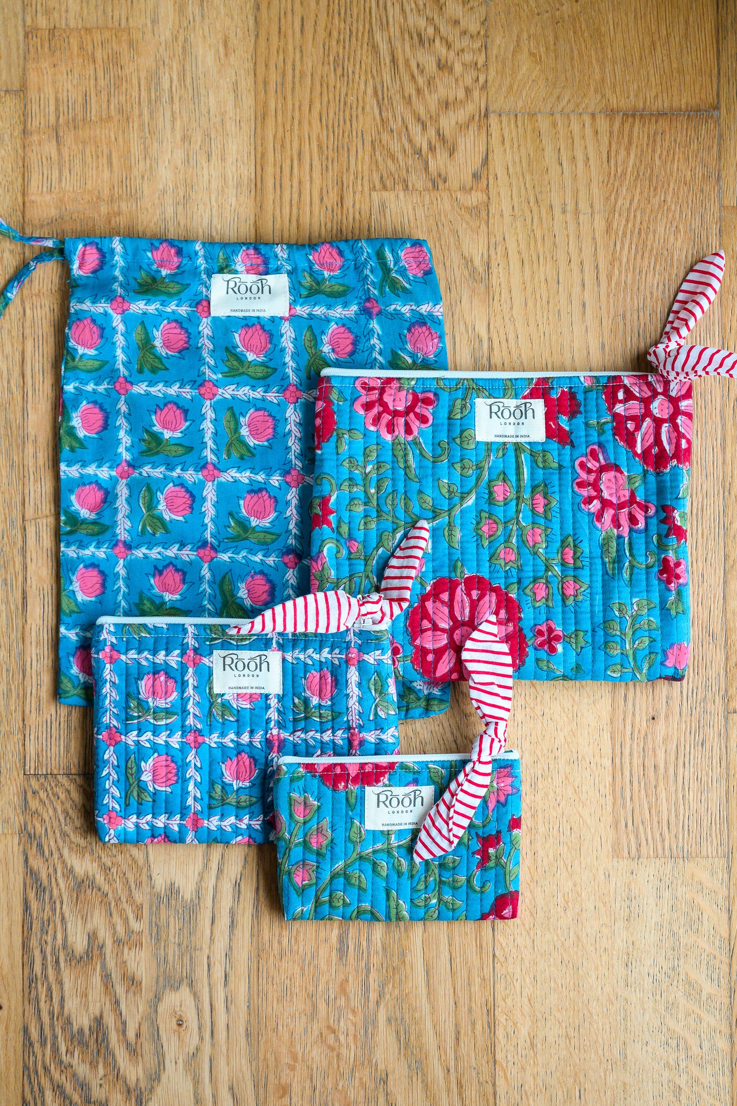 BLUE ROSETTE QUILTED TRAVEL & COSMETIC POUCH SET