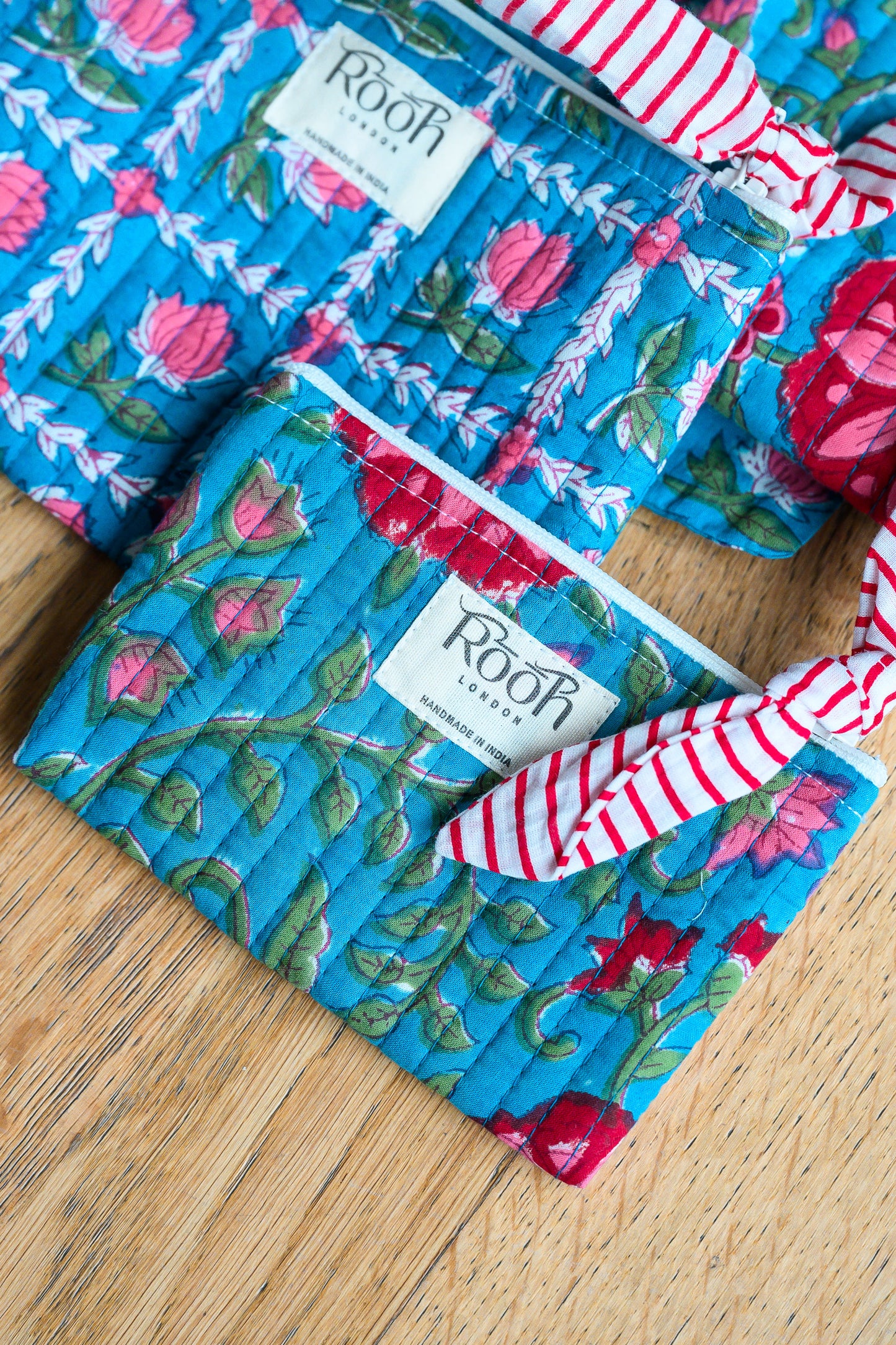 BLUE ROSETTE QUILTED TRAVEL & COSMETIC POUCH SET