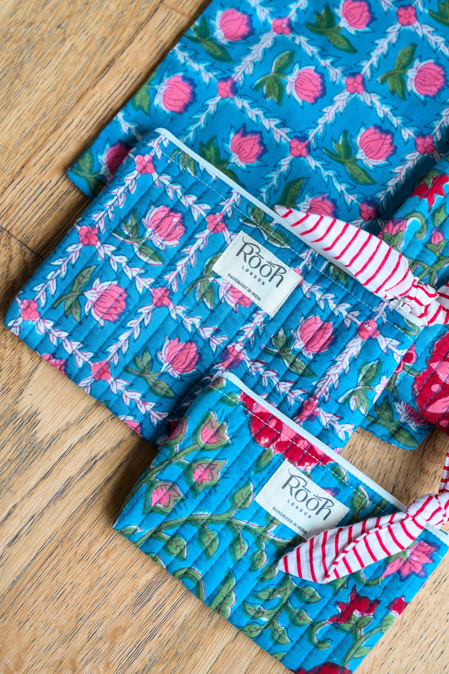 BLUE ROSETTE QUILTED TRAVEL & COSMETIC POUCH SET