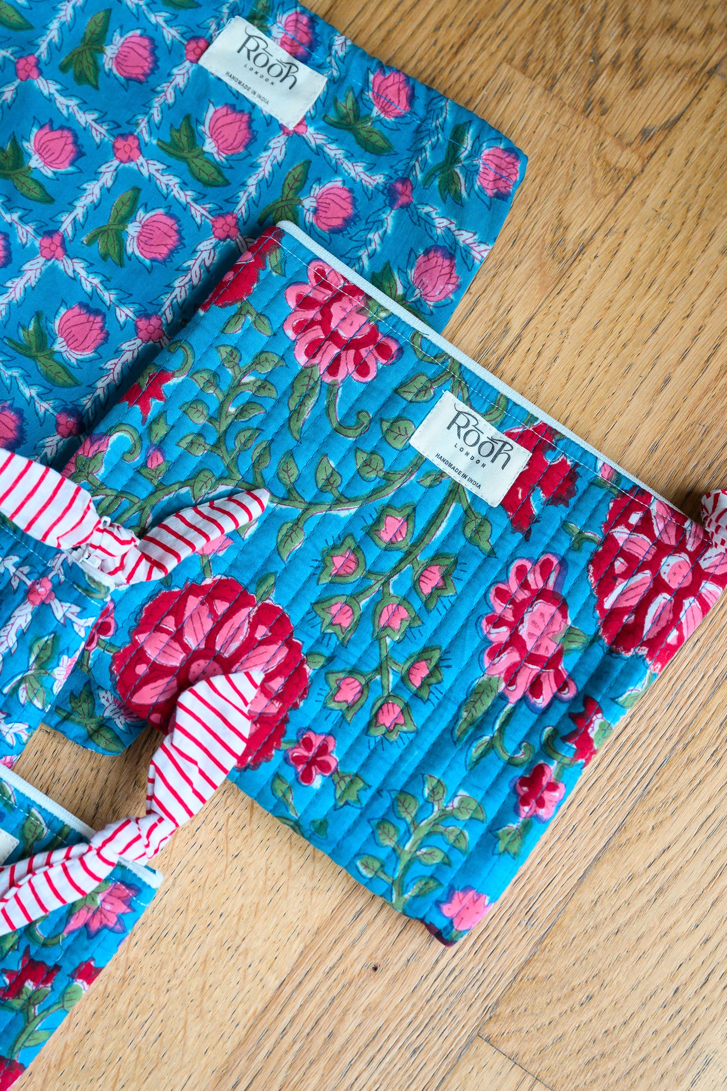 BLUE ROSETTE QUILTED TRAVEL & COSMETIC POUCH SET