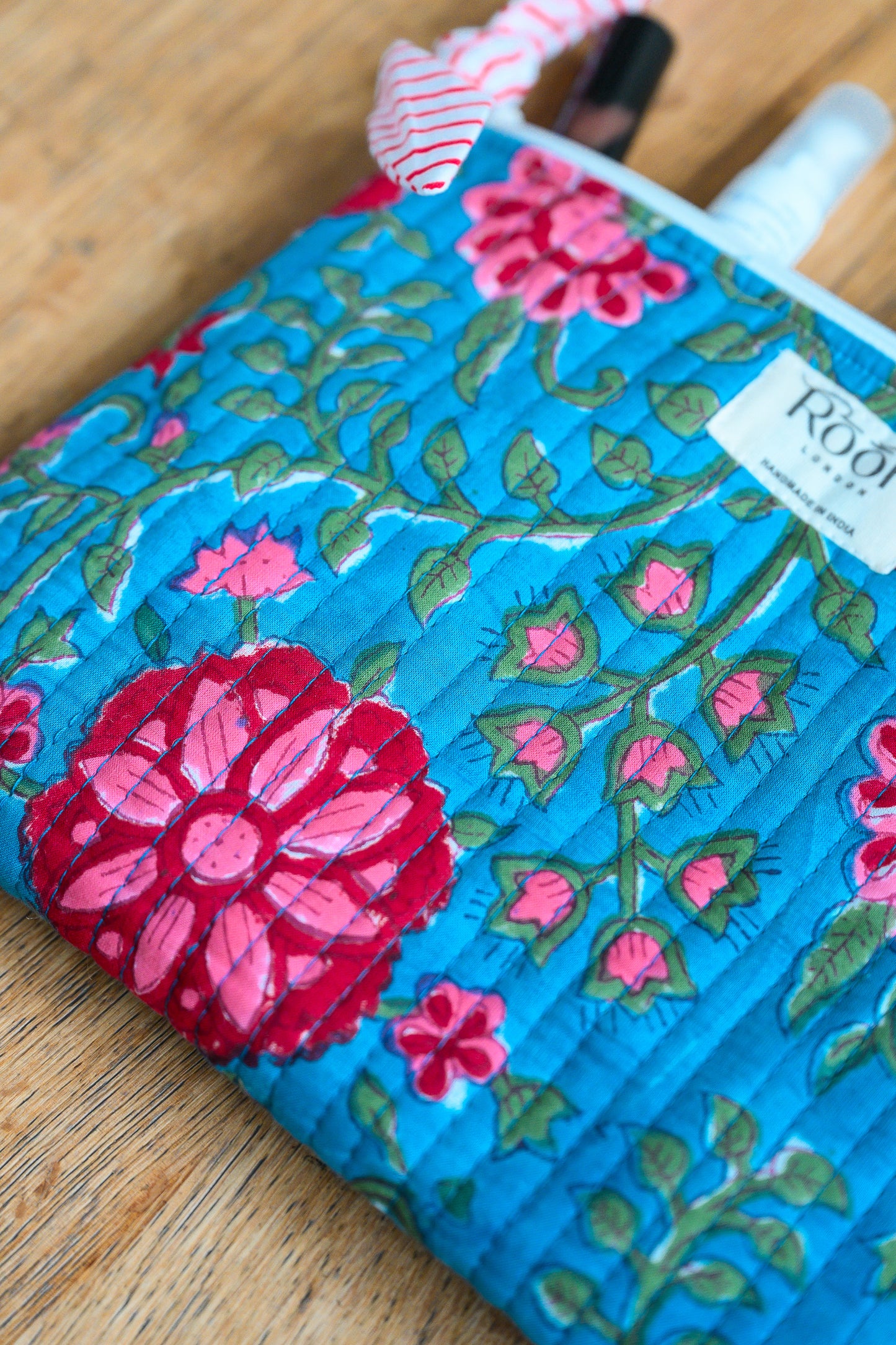 BLUE ROSETTE QUILTED TRAVEL & COSMETIC POUCH SET