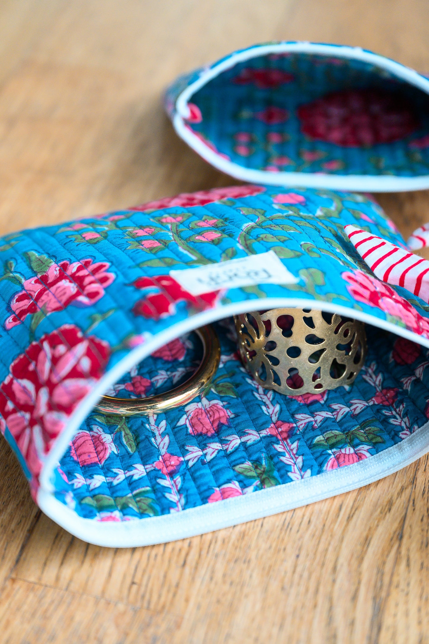 BLUE ROSETTE QUILTED TRAVEL & COSMETIC POUCH SET