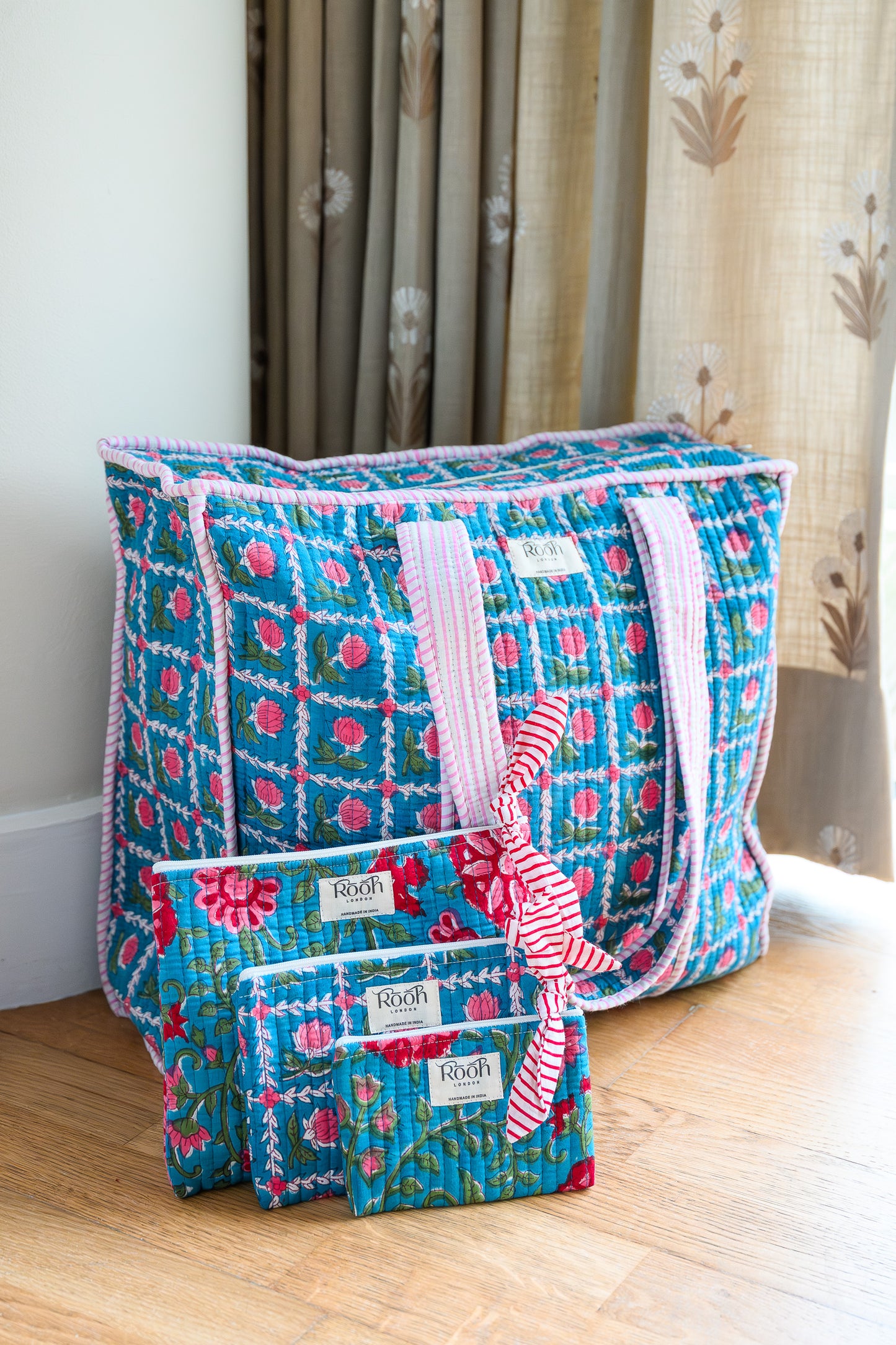 BLUE ROSETTE QUILTED TRAVEL & COSMETIC POUCH SET